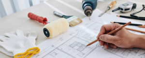 blueprint with drill paintbrush and gloves in omaha, NE