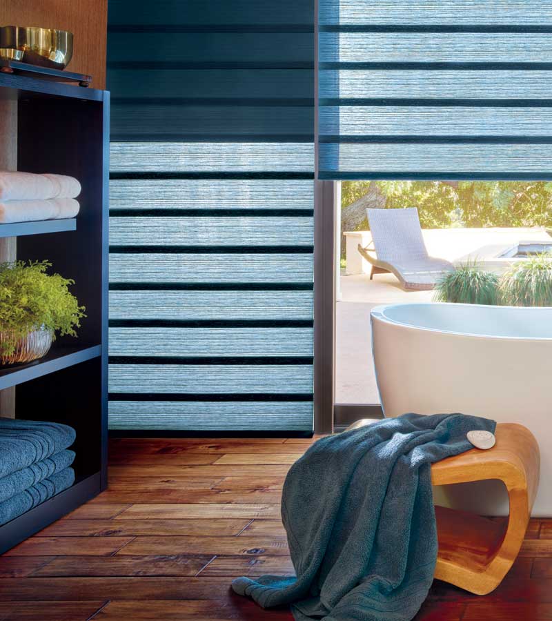 blue vignette modern roman shades with home automation in master bathroom