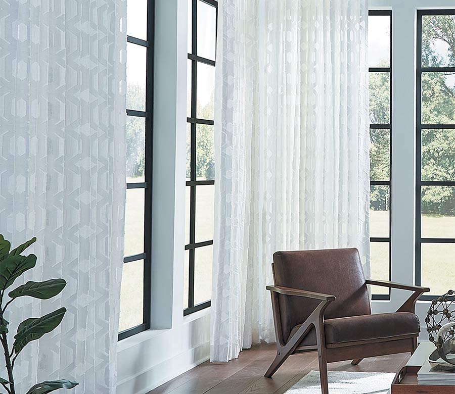 white sheer geometric pattern fabric for custom window treatments on black trim windows in Omaha