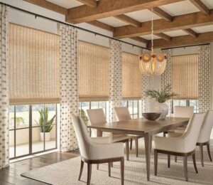 side drapery panels and window shades layered in a cozy modern dining room