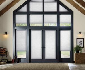 Applause® Honeycomb Shades in a living room with an arched ceiling