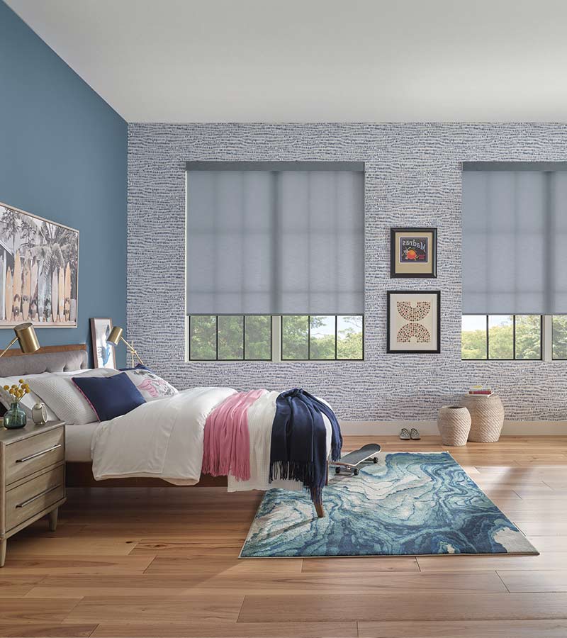 teen girls bedroom space skateboard and slate gray window roller shades